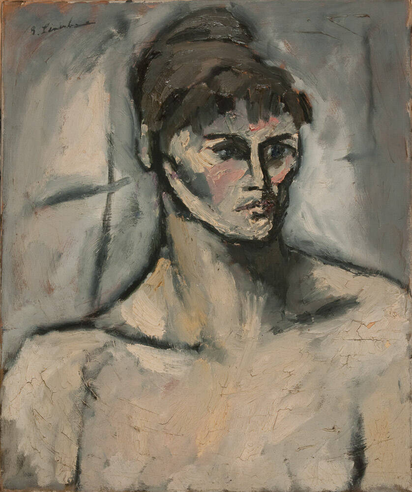 Portrait of a figure with dark hair in a bun on their head. Grey background.